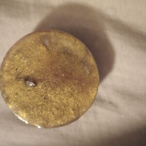 Gold Glittery Round Object